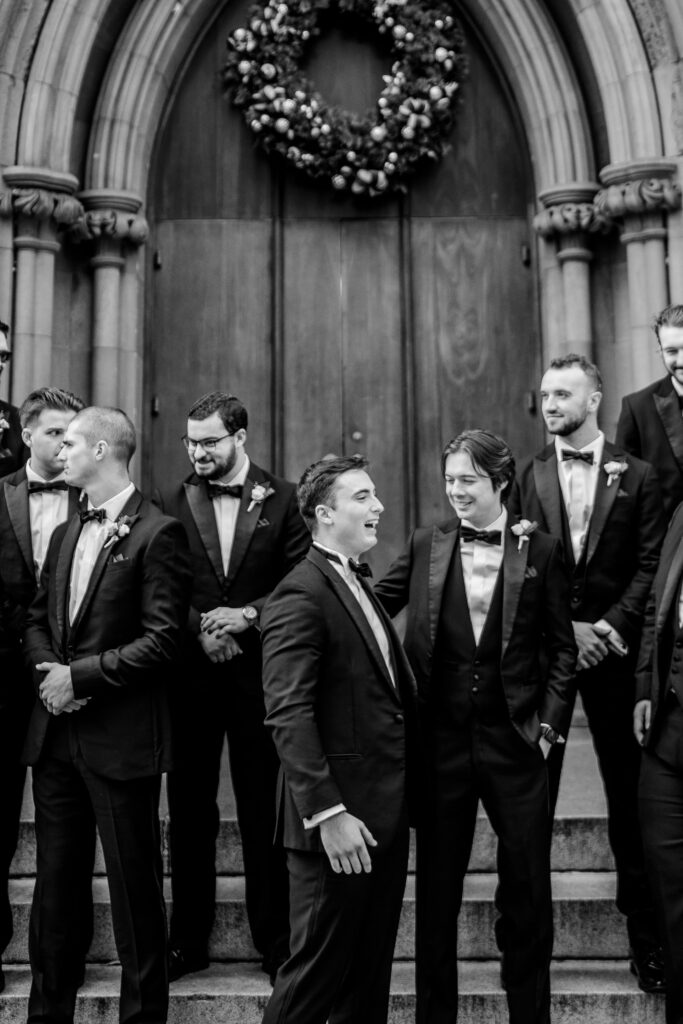 Groomsmen sharing a laugh before a St Dominic DC wedding