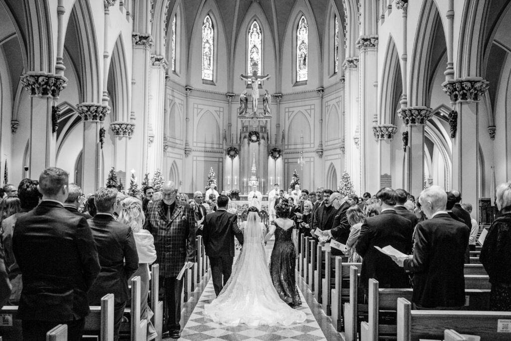 A bride walking down the aisle during her DC Christmas wedding