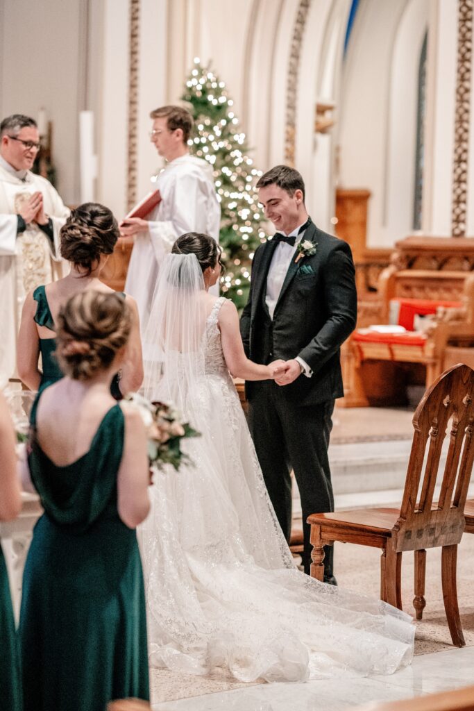 A bride and groom standing at the altar for their St Dominic DC wedding
