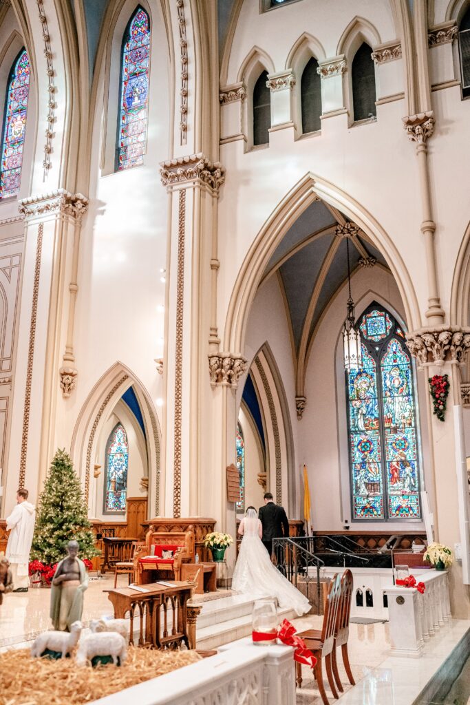 A bride and groom approaching the altar during their St Dominic DC wedding