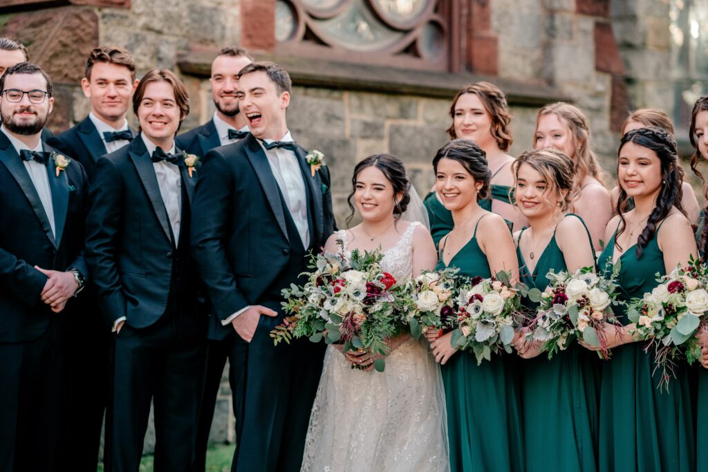 A wedding party laughs together for a portrait by Northern Virginia wedding photographer Beauty of the Soul Studio