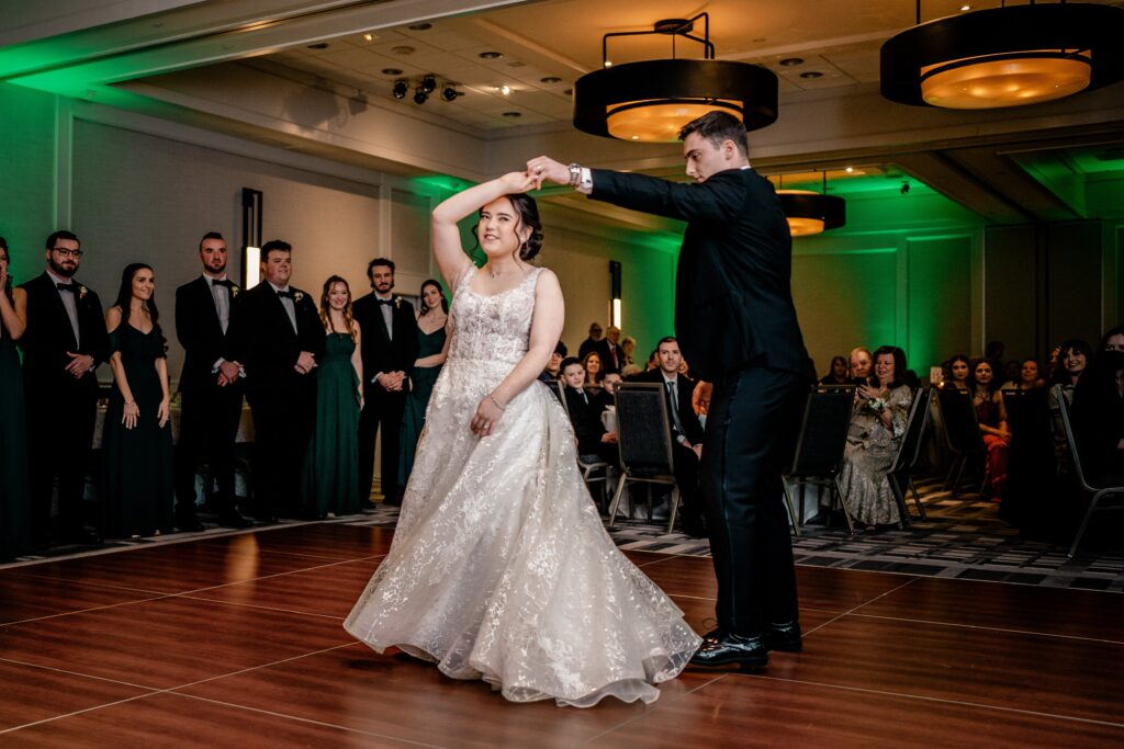 A bride and groom dance together during their DC Christmas wedding