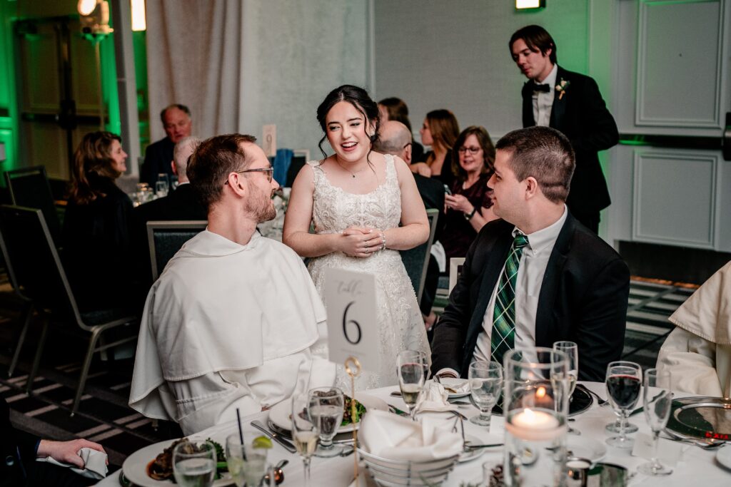 A bride laughs with her wedding guests at a DC Christmas wedding