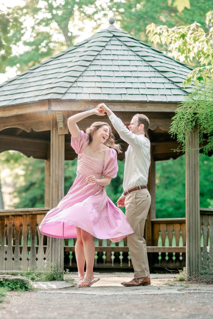 A couple twirling together for their Northern Virginia engagement photographer