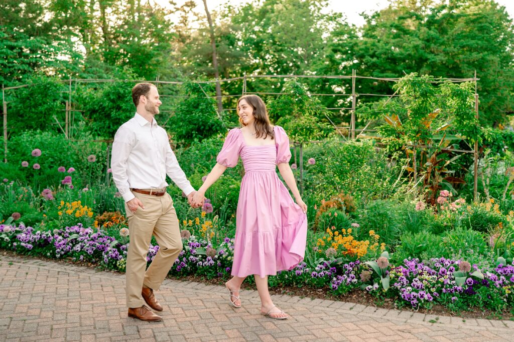 A couple walks together along a garden path at at one of the best garden venues in Northern Virginia