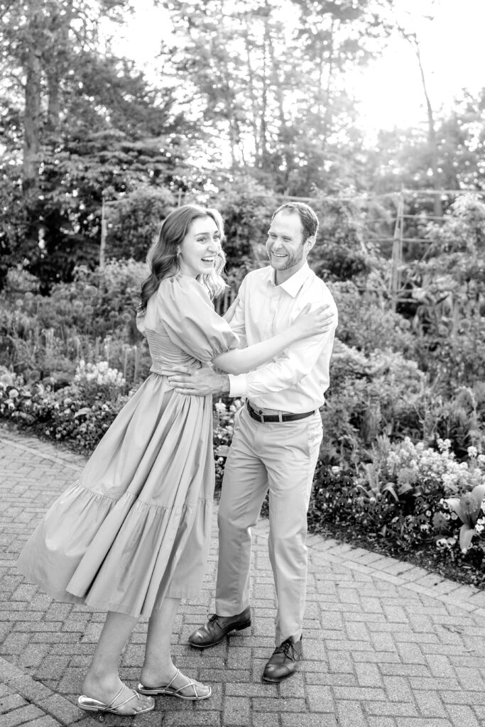 A candid moment of an engaged couple laughing together for their Green Spring Gardens photos