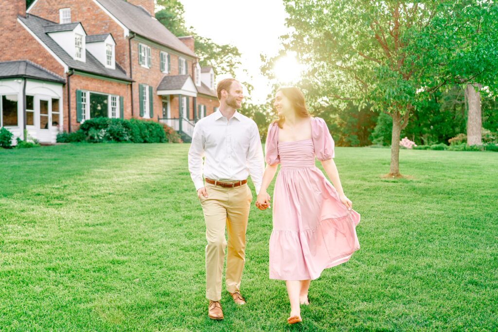 A couple walking together at sunset during their Green Spring Gardens photos