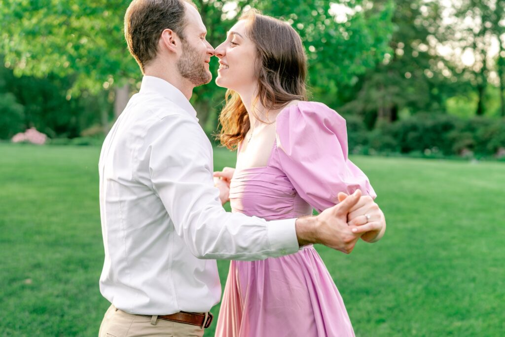 A couple dancing nose to nose during their Green Spring Gardens photos