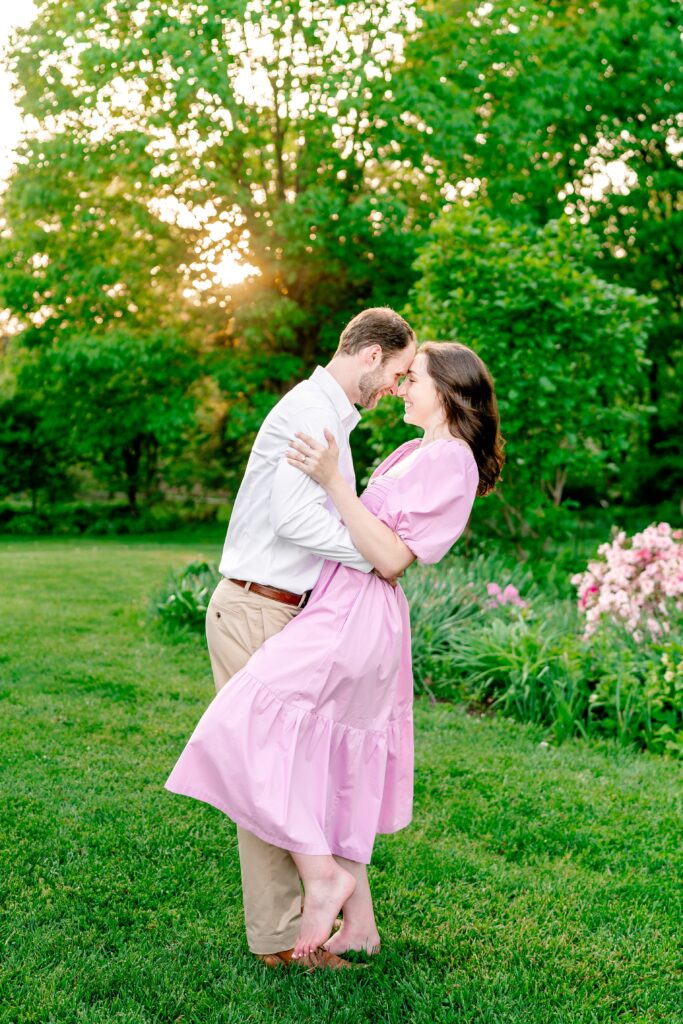 An engaged couple does a mini dip for their Northern Virginia engagement photographer