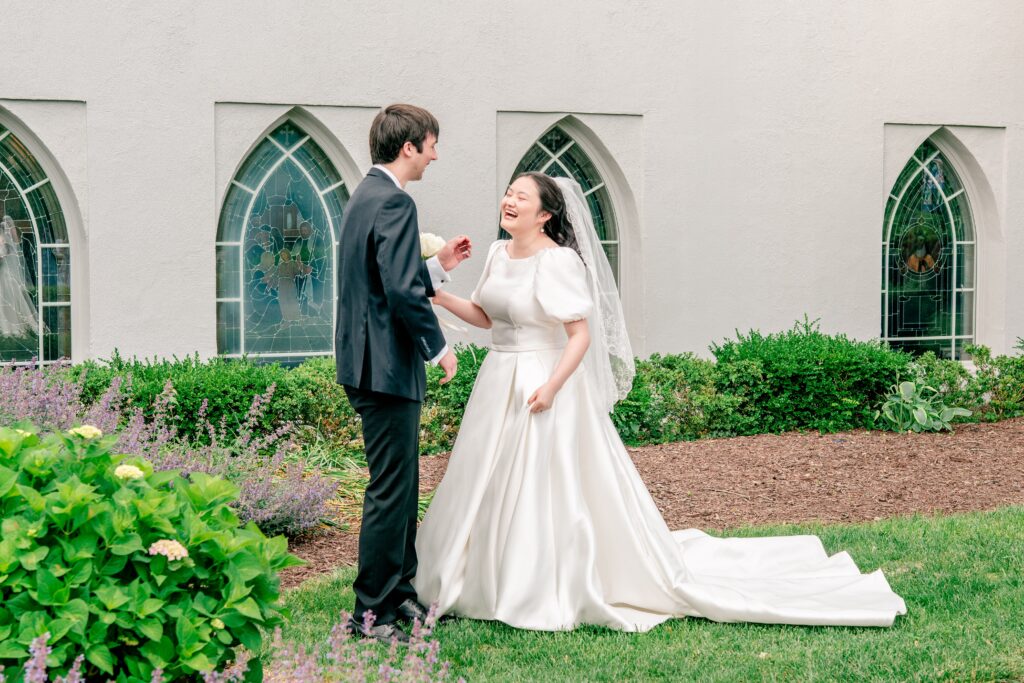 A bride and groom share a first look at the church before their Union Street Public House wedding