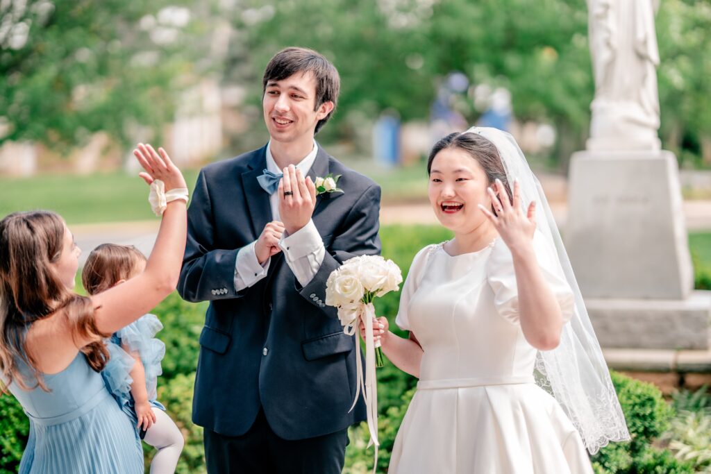 A bride and groom showing off their new rings the day of their Union Street Public House wedding