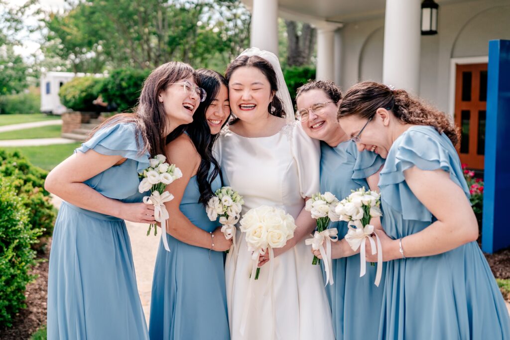 A bridal party laughing together