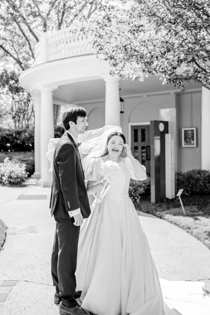 A bride and groom smiling in a candid moment the day of their Union Street Public House wedding