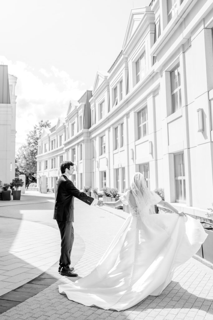 A bride and groom dancing together for portraits ahead of their Union Street Public House wedding