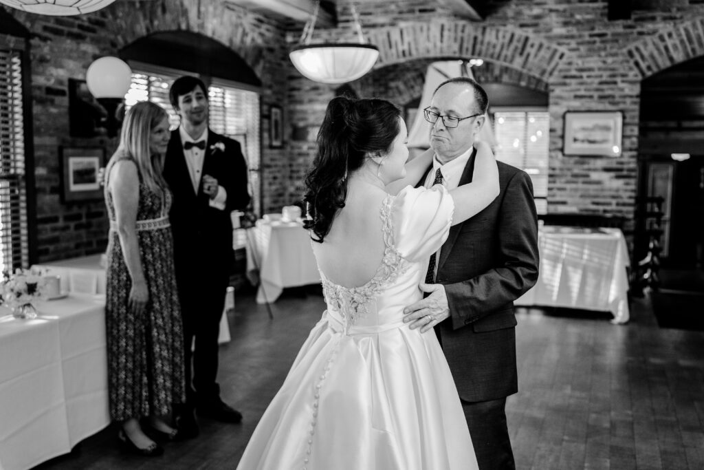 A bride and her father dancing together during her Union Street Public House wedding