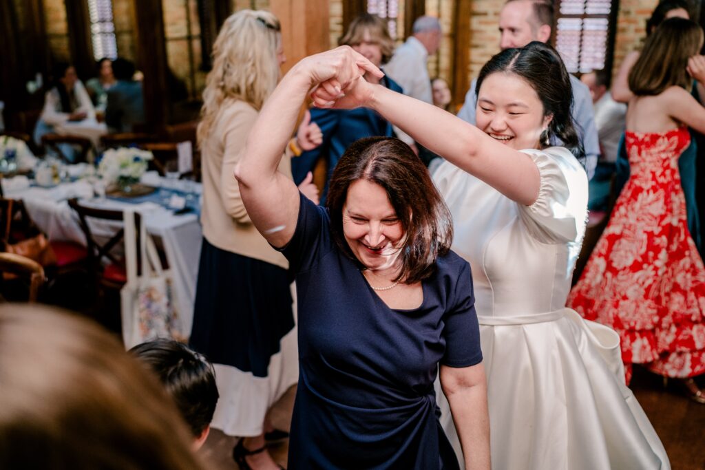 A bride and her mom dancing together during a Union Street Public House wedding