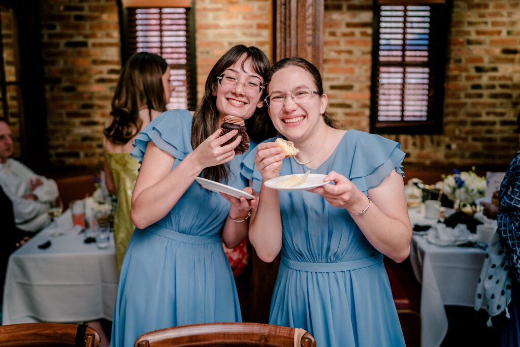 Bridesmaids sharing cupcakes together during a Union Street Public House wedding