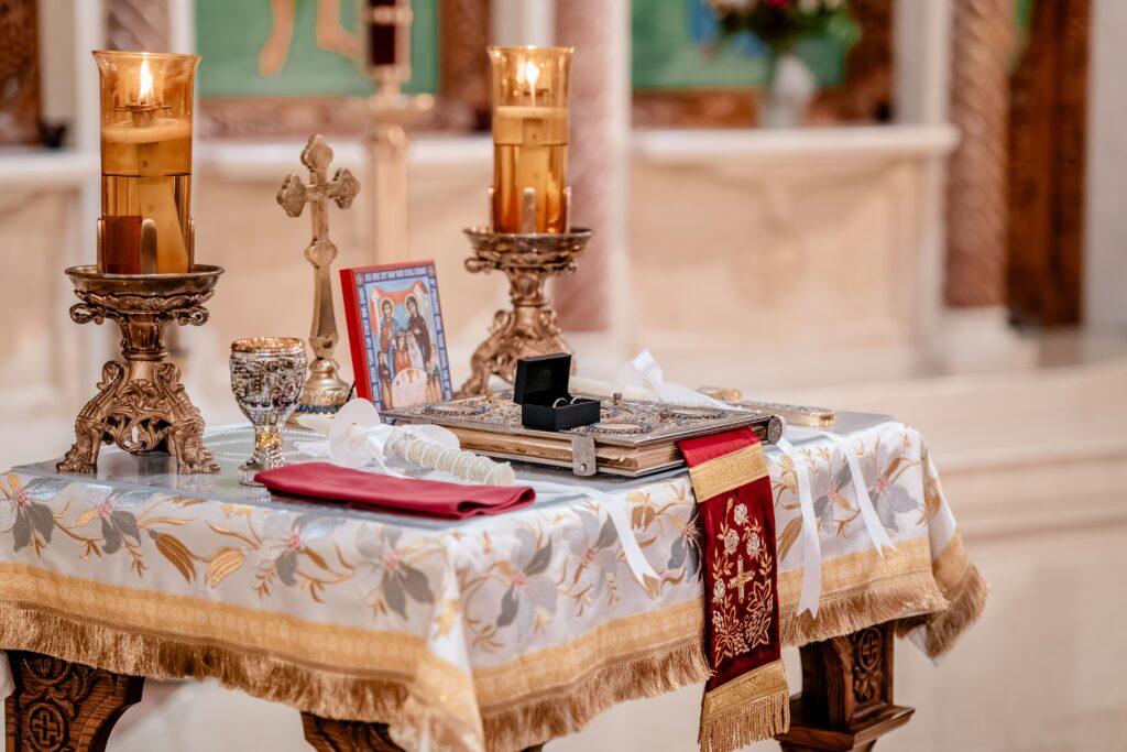 A close up of the items on a wedding table for a church wedding
