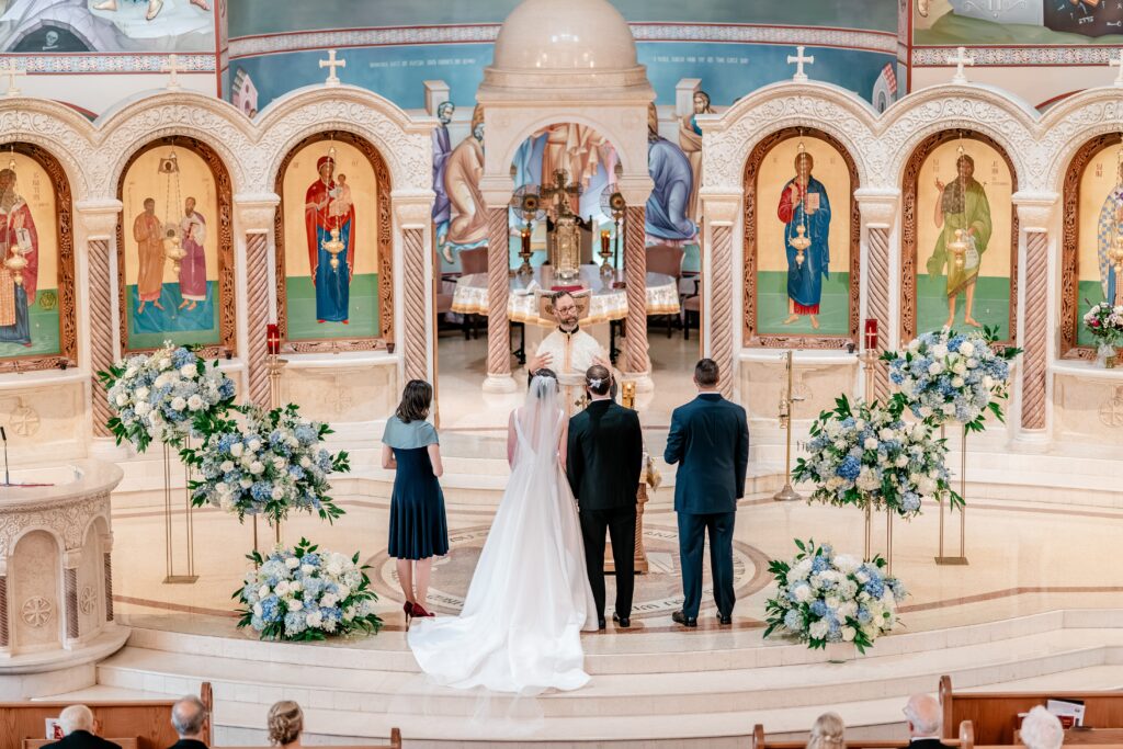 A priest giving the homily during a Greek Orthodox wedding