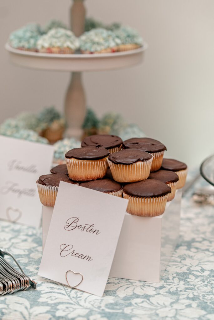 Boston cream cupcakes set up to celebrate a Greek Orthodox wedding