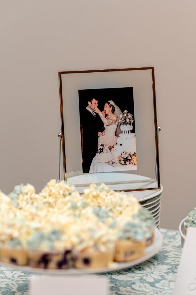 A vintage wedding portrait on a cake table by a colorful wedding photographer