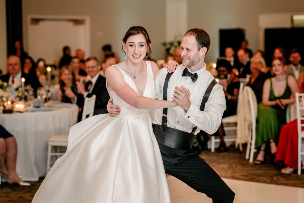 A bride and groom enjoying their first dance together after their Greek Orthodox wedding