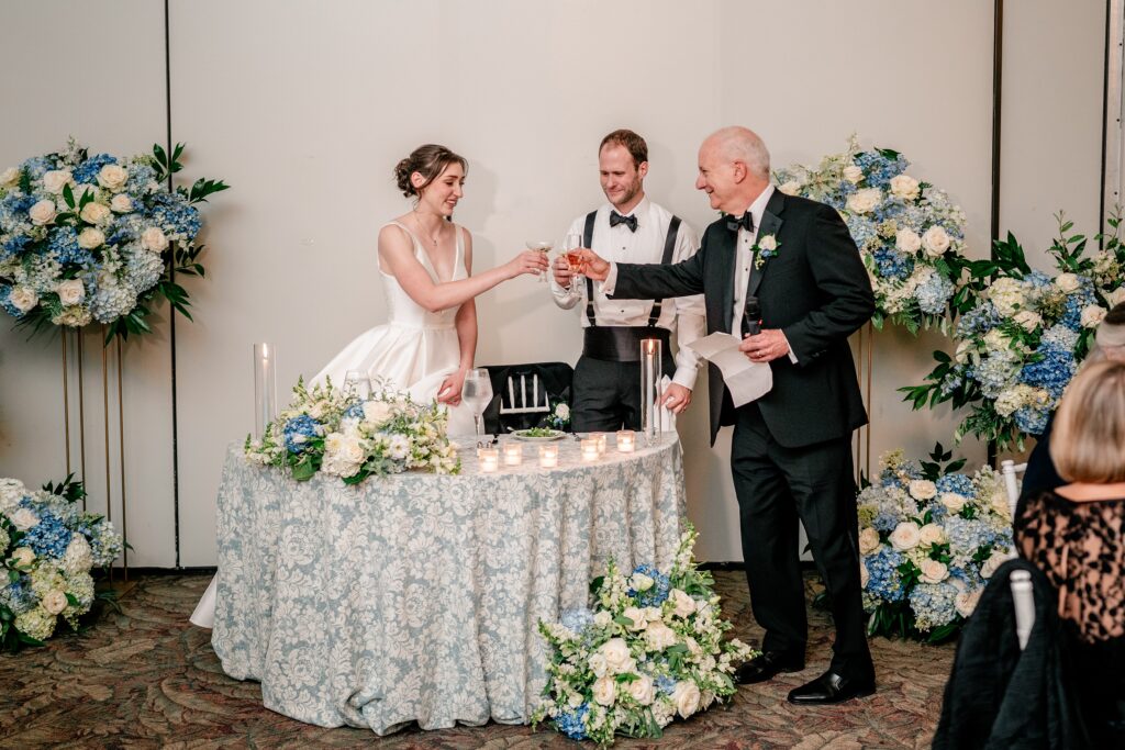 The father of the groom toasting the couple to celebrate their Greek Orthodox wedding