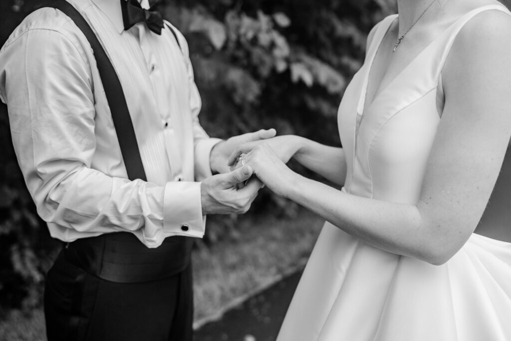 A bride and groom holding hands during their Greek Orthodox wedding