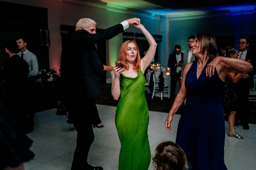 Wedding guests dancing together during a Sts. Peter and Paul Antiochian Orthodox Church wedding in Potomac, Maryland