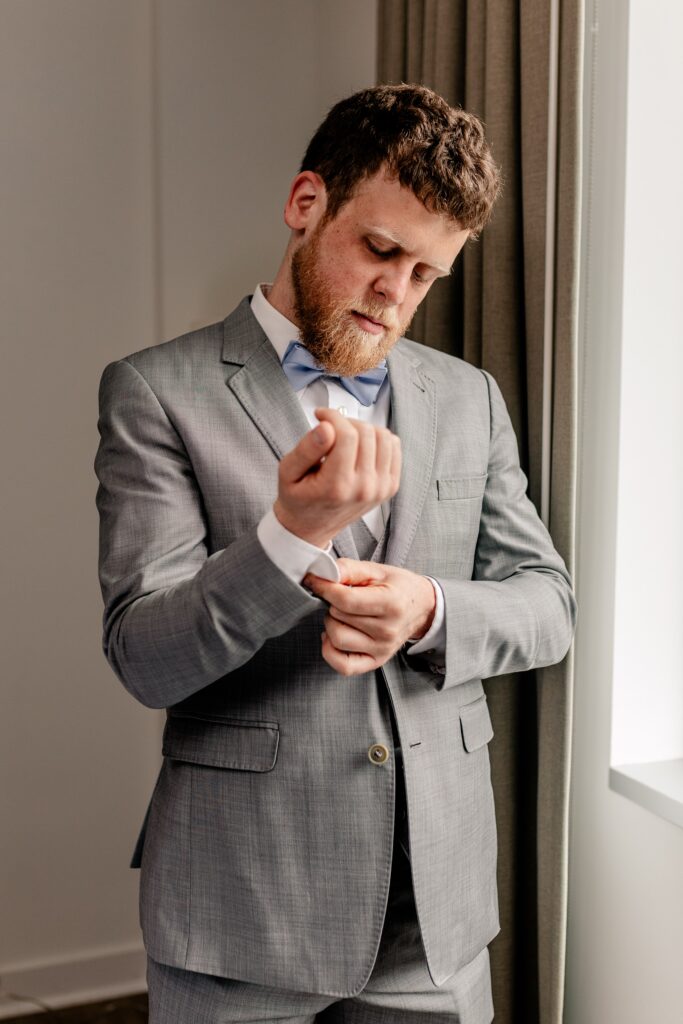 A groom getting ready for his Immaculate Conception Church wedding