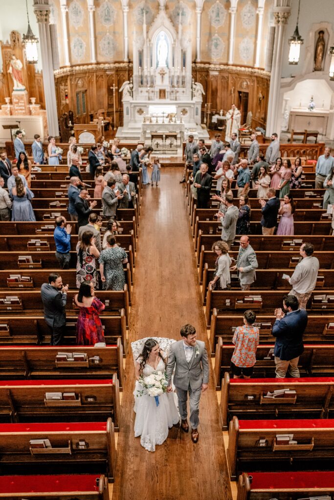 A view from above as the bride and groom recess down the aisle together