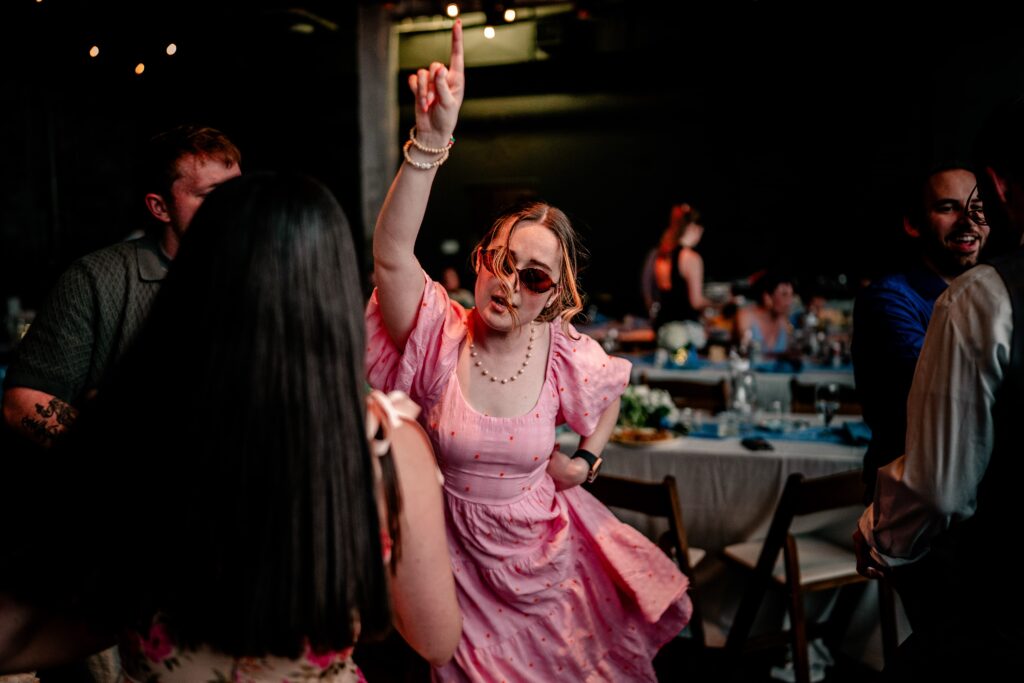 A guest dancing at a reception following an Immaculate Conception Church wedding