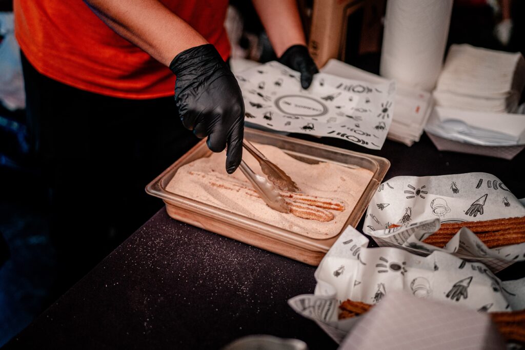A churro station at a wedding reception by a Washington DC wedding photographer