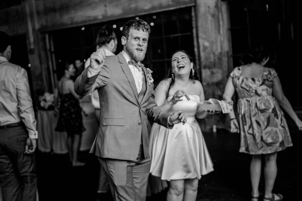 A bride and groom dancing together after their Immaculate Conception Church wedding