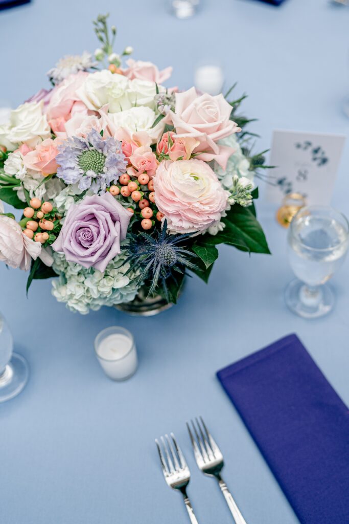 A floral arrangement on a reception table for a Meadowlark Botanical Gardens wedding