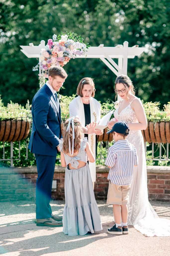 Children bring up the wedding rings during a Meadowlark Botanical Gardens wedding