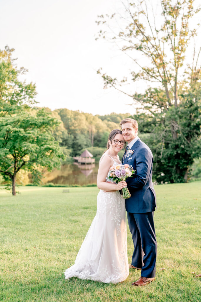 A bride and groom pose for a portrait at golden hour during their Meadowlark Botanical Gardens wedding