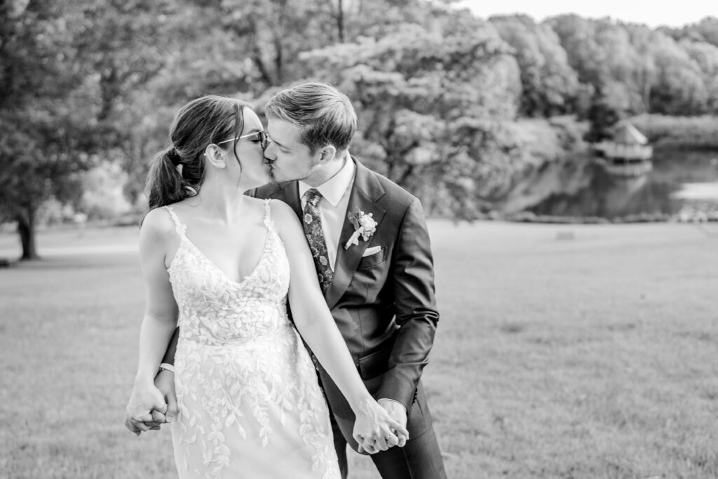 A bride and groom share a kiss during their Meadowlark Botanical Gardens wedding