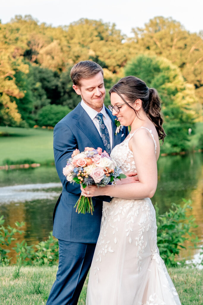 A bride and groom smiling during their Atrium at Meadowlark wedding
