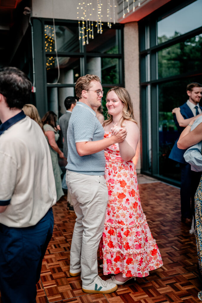 Wedding guests dancing together during an Atrium at Meadowlark wedding