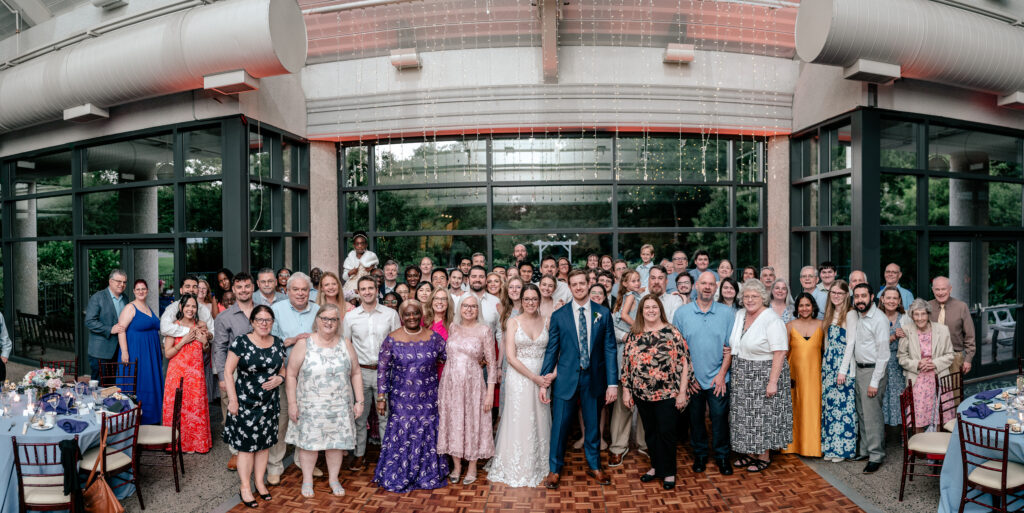 A group photos on the dance floor at a wedding reception