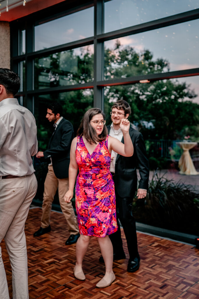 A pair of guests dancing at a Meadowlark Botanical Gardens wedding
