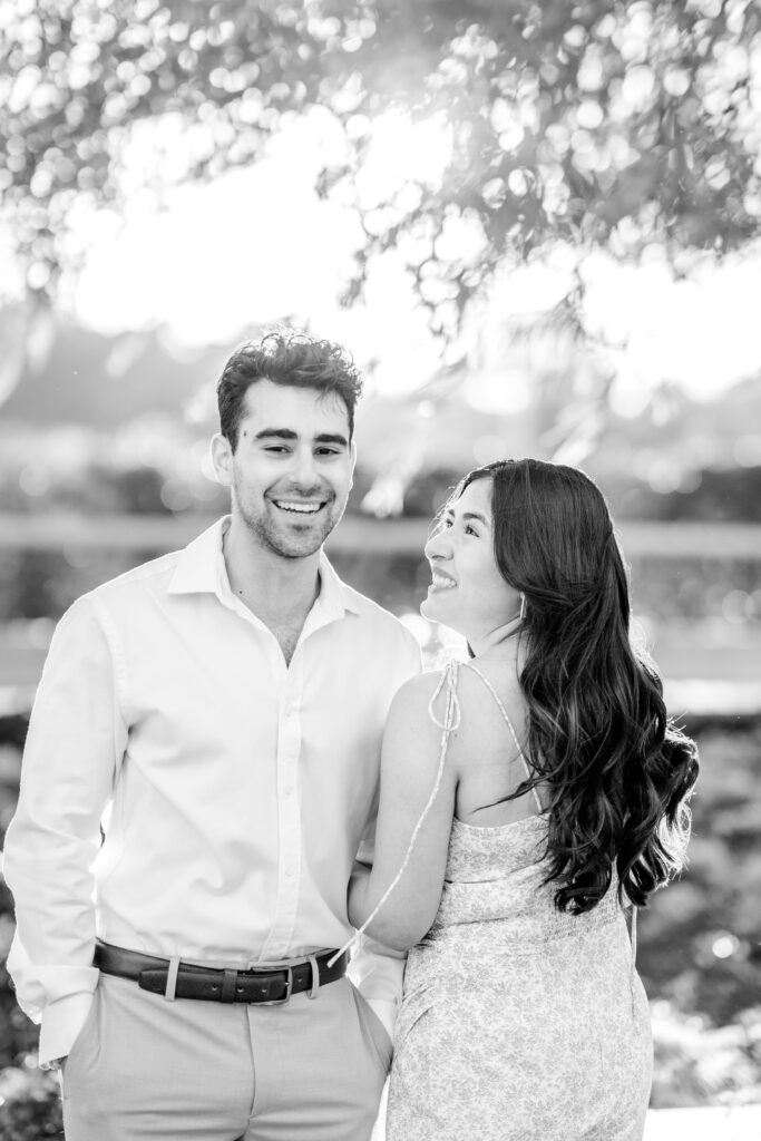 An engaged couple laughing together