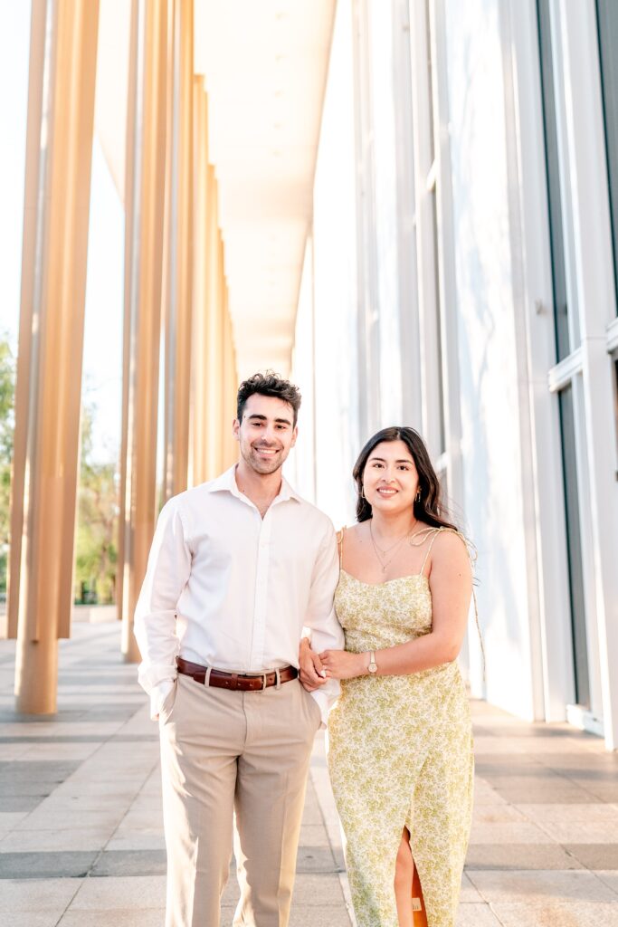 A couple smiling for a classic portrait during their Kennedy Center engagement photos