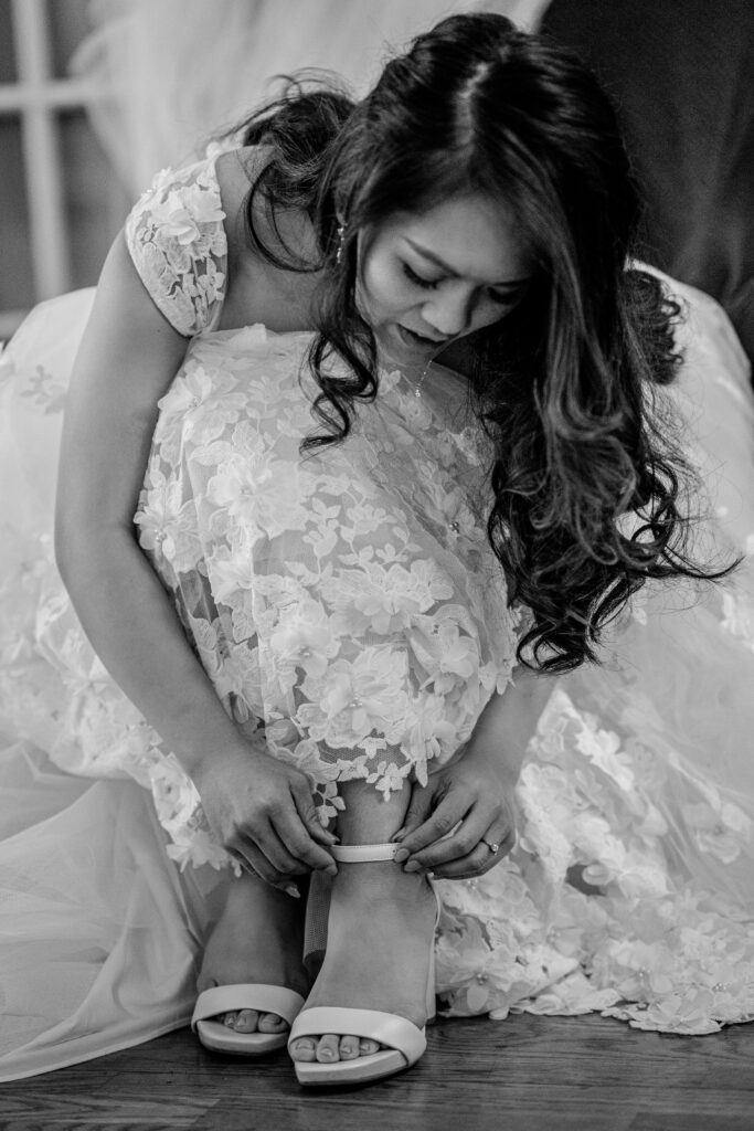 A bride putting on her shoes before her Loudoun County wedding