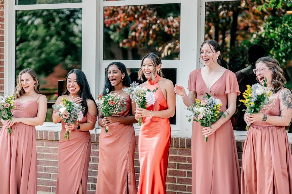 A group of bridesmaids cheering for the bride during a Murray Hill wedding