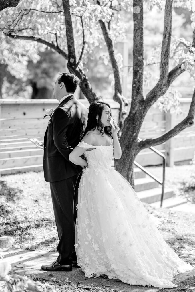 A bride and groom's first touch before a St. John the Beloved wedding