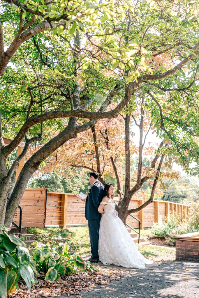 A bride and groom having a first touch prayer moment together
