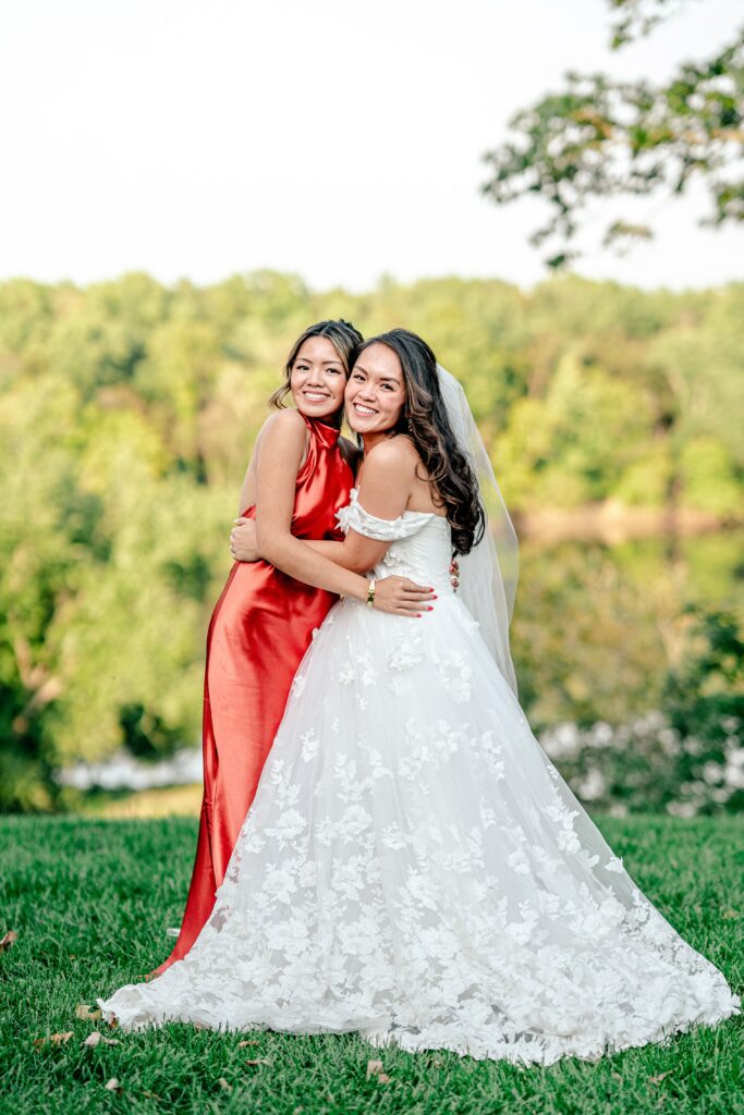A bride and her maid of honor pose together during a Murray Hill wedding