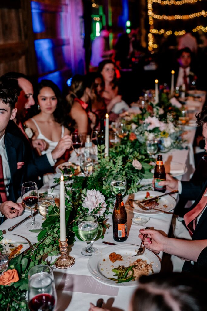 A table full of flowers and food during a Loudoun County wedding